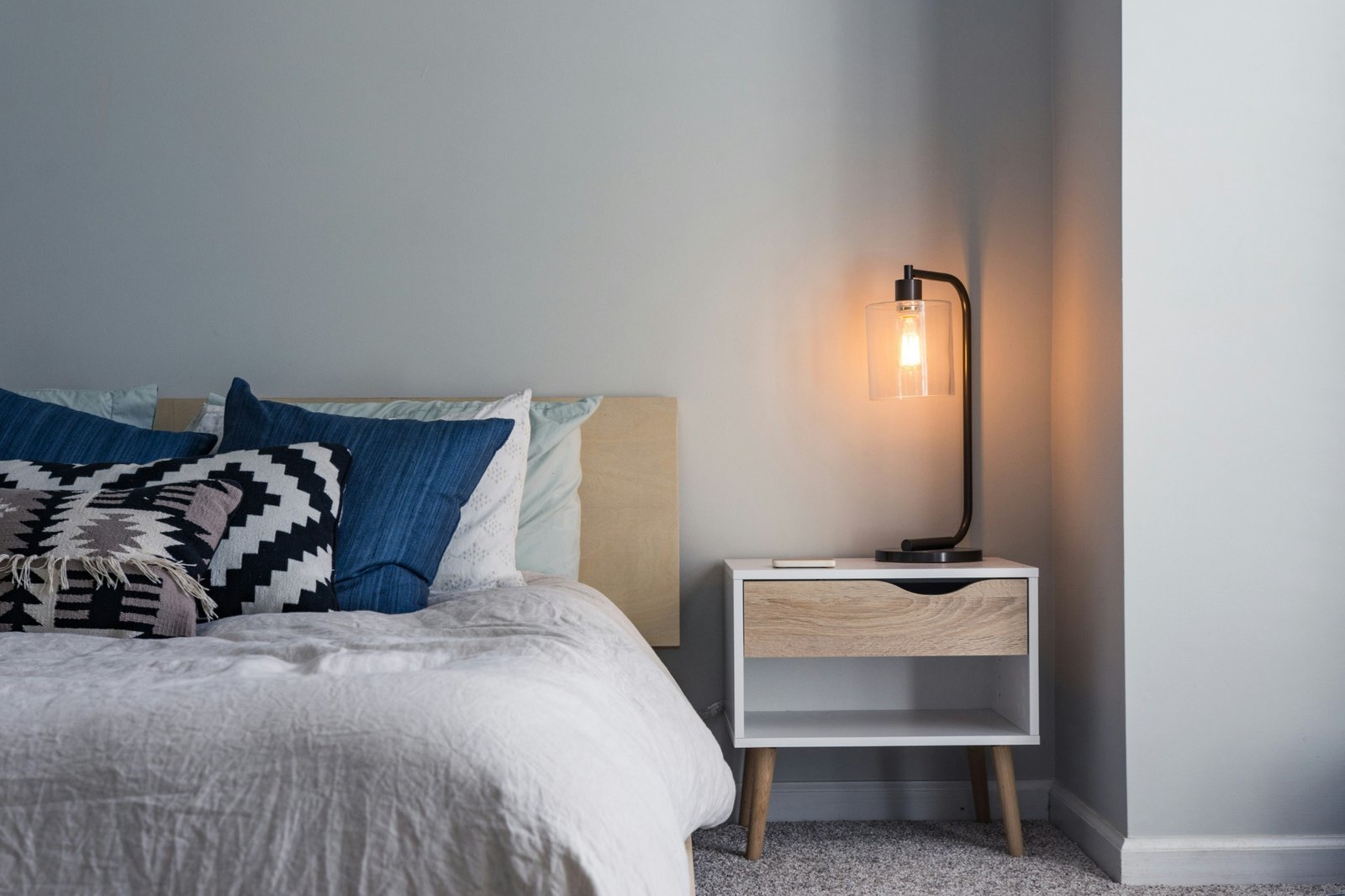 Comfortable bedroom with blue pillows